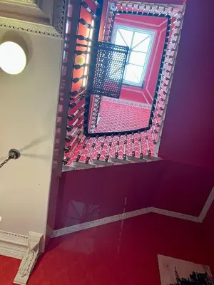 a room with a window and a red floor at Eliza House in Edinburgh