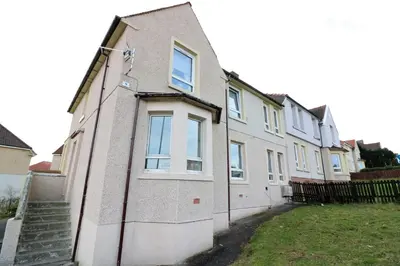 a row of houses on a street at Signature - Gartlea House in Airdrie