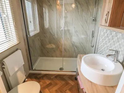 a bathroom with a shower and a sink at Avonal Lodge 24 in Perth