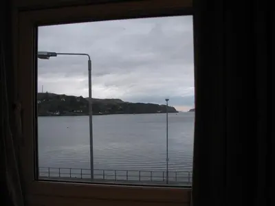 a window with a view of a body of water at Lancaster Hotel in Oban