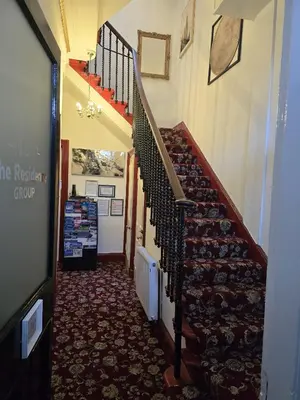 a hallway with a staircase in a house at The Residence - NO 57 in Edinburgh
