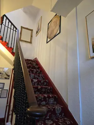 a staircase in a house with a stair case at The Residence - NO 57 in Edinburgh
