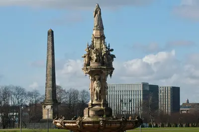 a monument in a park in front of a building at The Stables - Fabulous stylish flat in Merchant City & Free Secure Parking in Glasgow
