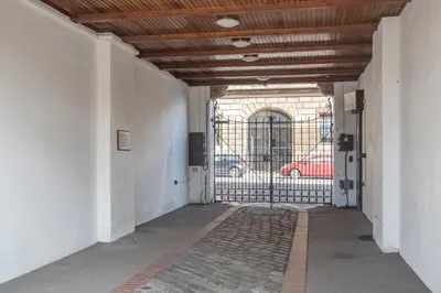 an empty hallway with a gate in a building at The Stables - Fabulous stylish flat in Merchant City & Free Secure Parking in Glasgow