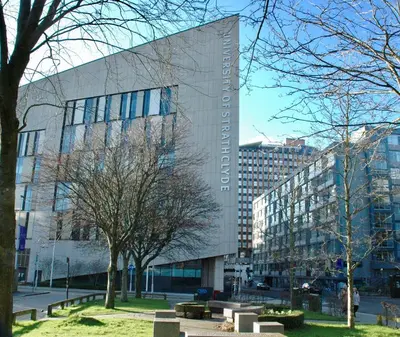 a large building with trees in front of it at The Stables - Fabulous stylish flat in Merchant City & Free Secure Parking in Glasgow