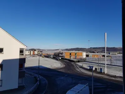 a view of a street with a building and a road at 3 Royal View Apartments in Stirling