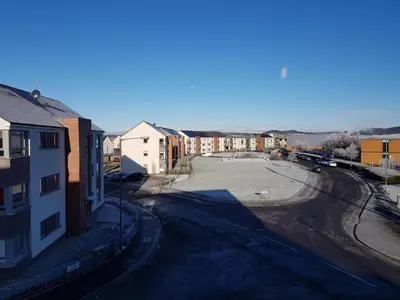 an empty street in a city with buildings at 3 Royal View Apartments in Stirling