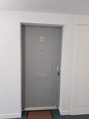 a door in a room with a white wall at 11 Royal View Apartments in Stirling