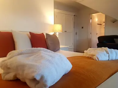 a bed with two white towels on top of it at Kames Hotel in Tighnabruaich