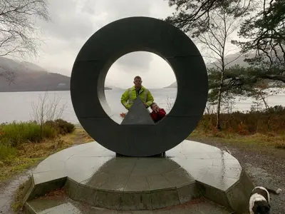 a man is standing in a mirror in a sculpture at Ben Lomond Lodge in Rowardennan