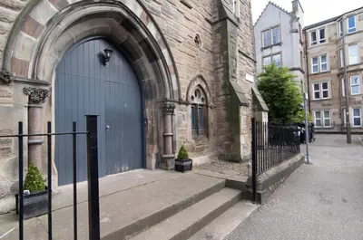 an entrance to a building with a blue door at Edinburgh Church Apartments in Edinburgh