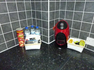 a kitchen counter with a red appliance in the corner at Paisley Central Apartment #4 in Paisley