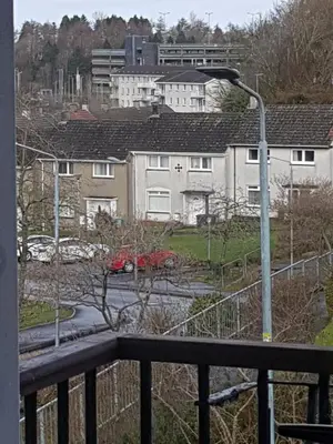 a view from a balcony of houses and a street light at Carnegie Place in East Kilbride