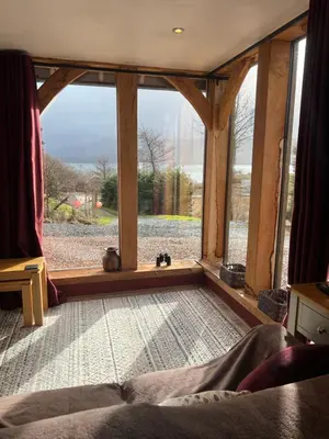a room with a large window with a view at Tigh a Chabar in Lochaline