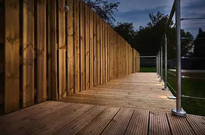 a wooden walkway with a wooden fence at Luxury Hideaways in Keilour