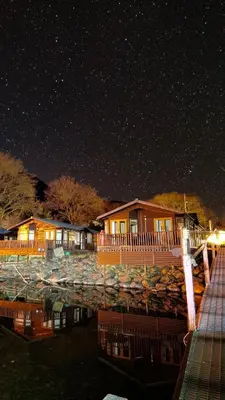 a house at night with a starry sky at Bonnie Banks Lodge Ardlui in Ardlui