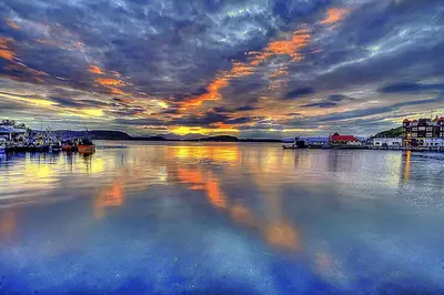 a large body of water with a cloudy sky at Hayfield Apartment in Oban