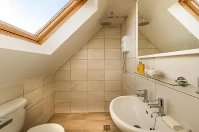 a bathroom with a toilet and a sink at Thornhill House - Historic 5 Bedroom 5 Ensuite in Stirling
