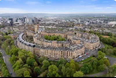 an aerial view of a city with buildings at Grand in the Park in Glasgow