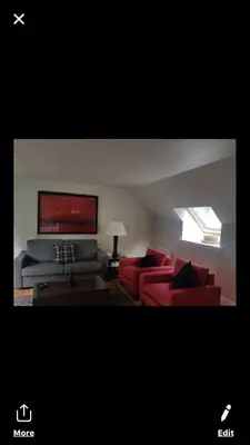 a living room with two red couches and a couch at Luxury 2Bedroom Lodge in Auchterarder