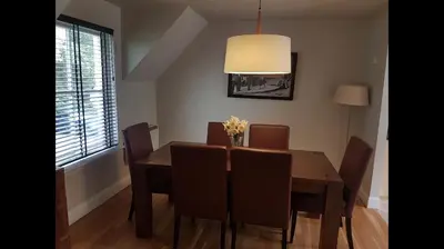 a dining room with a wooden table and chairs at Luxury 2Bedroom Lodge in Auchterarder