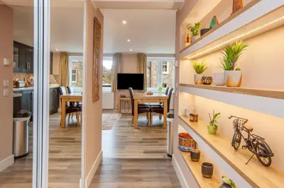 a kitchen and living room with a dining room at Mandarin Premier Apartments C - studio apt in Oban