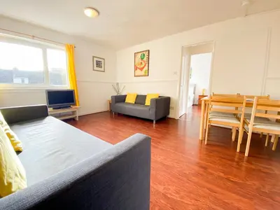 a living room with a couch and a table at Glasgow Green Park Home in Glasgow