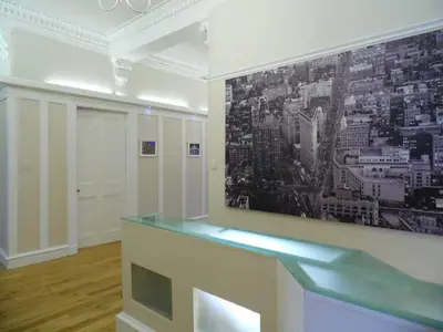 a room with a picture of a city on the wall at WEST END - Stunning, spacious, 3 bedroom, main door flat with private parking in Glasgow