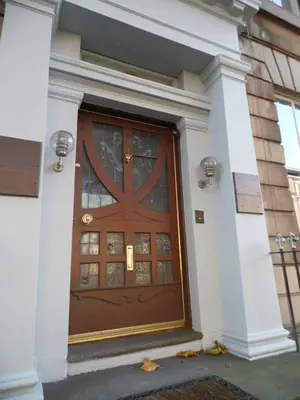 a large wooden door on a building at WEST END - Stunning, spacious, 3 bedroom, main door flat with private parking in Glasgow