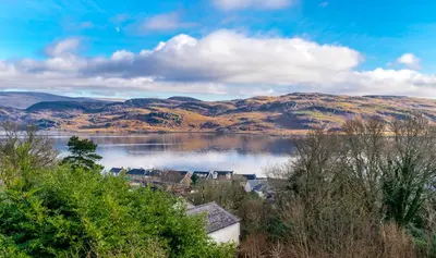 a view of a lake with hills in the background at The Tregortha B&B in Tighnabruaich