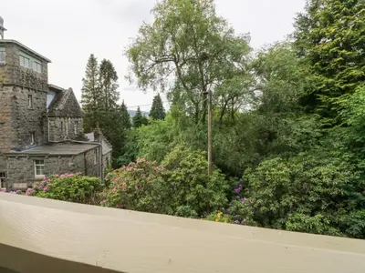 a view of a garden from a house at Tower Lodge in Dalmally