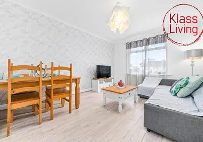 a living room with a couch and a table at Anderson Apartment by Klass Living Motherwell in Motherwell
