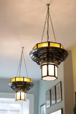 two lights hanging from the ceiling in a room at Frederick Street - stylish apartment in the heart of New Town! in Edinburgh