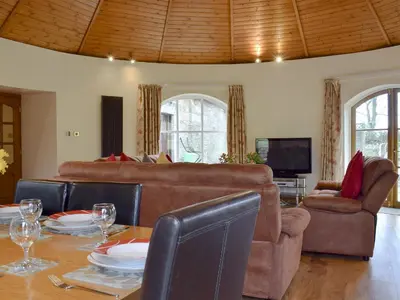 a living room with a table and a couch at Horsemill - Uk10794 in Ballingry