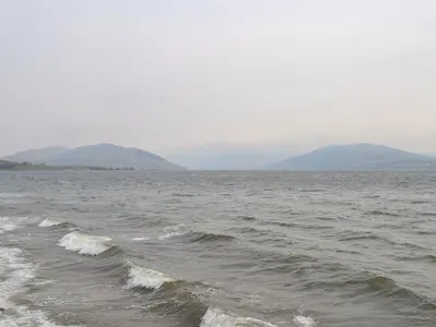 a large body of water with mountains in the background at Fircliff - The House On Bute in Port Bannatyne