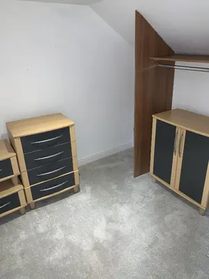 a room with two wooden drawers and a cabinet at The Village Tavern Apartment in Larkhall