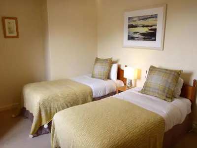 a room with two beds in a hotel room at Camus Bhan in Ballachulish