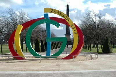 a large sign in a park with a peace sign at The Socair - Bright Contemporary Merchant City Flat in Central Location in Glasgow