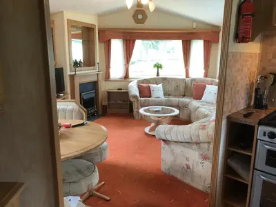 a living room with a couch and a table at Bermuda 29 in Dunoon