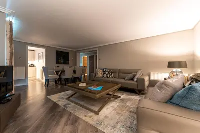 a living room with a couch and a table at Gleneagles Apartment - Guthrie Court Gleneagles in Auchterarder