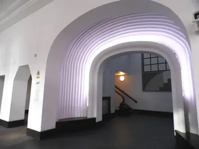 a hallway with an archway in a building at Art Deco Building on Vibrant Sauchiehall Street in Glasgow