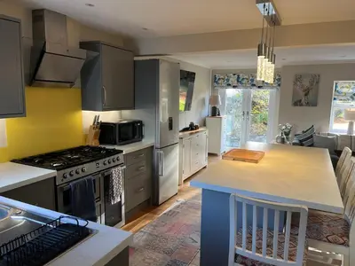 a kitchen with a stove and a counter top at Kilmory Garden by the Loch in Lochgilphead