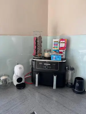 a corner of a room with a table with a blender at “A Wee Pad in Dunfermline” in Dunfermline