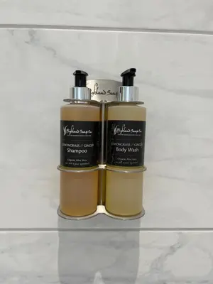 two bottles of soap sitting on a shelf at The Farmhouse B&B in Dunkeld
