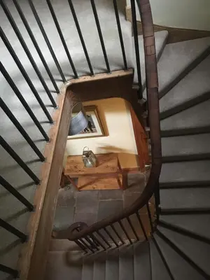 a spiralling staircase with a spiral stair case at The Farmhouse B&B in Dunkeld