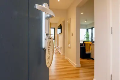 a close up of a door with a tag on it at The Salt Lodge in Troon