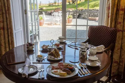 a wooden table with food on top of it at Kilmeny in Ballygrant