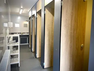 a row of stalls in a dressing room at Inversnaid Bunkhouse in Inversnaid