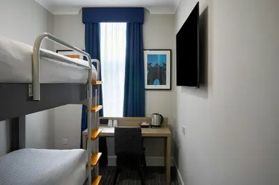 a room with a desk and a bunk bed at Four Points Flex by Sheraton Edinburgh in Edinburgh