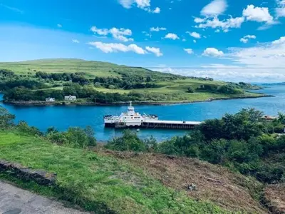 a large boat in a large body of water at White Watch in Lochaline